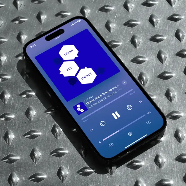 A smartphone on a metal chequer plate surface displays a podcast episode. The screen shows a blue cover with the words LEARN, ACT, and IMPACT in white hexagons, and playback controls beneath.