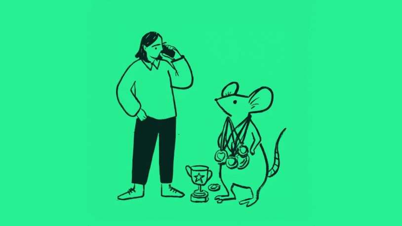A person stands thoughtfully next to a mouse wearing several medals around its neck, with two trophies on the ground in front of them, all on a green background—capturing the essence of brand identity and achievement.
