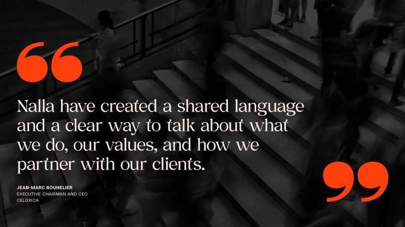 Blurred black-and-white photo of people on stairs, overlaid with a quote about shared language and values in business, large orange inverted commas, and attribution to Jean-Marc Bouhelier, Executive Chairman and Chief Executive, CELLOXICA—an inspiring visual often found at a brand strategy agency.